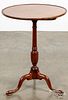 Walnut tilt top candlestand, early 19th c.