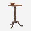 A Federal carved mahogany candlestand together with turned wood bowl The table probably Rhode Island, late 18th century and 19th century