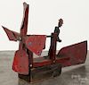 Painted sheet iron and pine whirligig, 20th c., 14'' h., 20'' w.