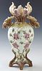 Large Eichwald Art Nouveau Majolica Vase, c. 1880, #735, with a scalloped floral decorated rim over double leaf form handles, to floral and leaf relie