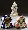 Group of Three Mantel Clocks, early 20th c., consisting of a porcelain time and strike example in cobalt blue and gilt decoration; an Ansonia ceramic 