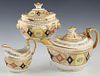 Three Piece Porcelain Tea Set, 19th c., unsigned, possibly Derby, consisting of a teapot, creamer and covered sugar, with gilt tracery and orange and 