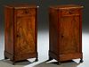 Pair of Louis Philippe Carved Walnut Nightstands, 19th c., the stepped canted corner top over a frieze drawer above a long cupboard door, on a plinth 
