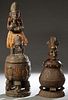 Two Unusual African Carved Wooden Covered Jars, 20th c., one with a female bust handle, the whole mounted with red beads and cowrie shells; the second