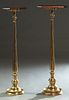Near Pair of Mahogany and Brass Altar Candlesticks, late 19th c., one with a stepped octagonal mahogany top; the second with a stepped rectangular oct