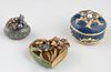 Three Enameled Pillboxes, 20th c., one Jay Strongwater example, of heart shape, mounted with faux precious stones; H.- 1 1/4 in., W.- 2 1/4 in., D.- 2