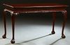 Chippendale Style Carved Mahogany Console Table, 20th/21st c., the stepped rectangular top over a carved skirt, on cabriole legs with large ball and c