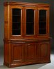 French Louis Philippe Style Carved Cherry Buffet a Deux Corps, 20th c., the stepped rounded crown over triple arched glazed doors, on a stepped base w