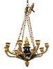 French Empire Style Hanging Light, having eight gilt bronze torch light holders with green patinated metal body, height 11 inches, diameter 18 inches.