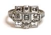 An Art Deco diamond set square cluster ring,