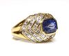 An 18ct gold sapphire and diamond bombé cluster ring,