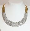 A two colour gold diamond set bib necklace with a graduated centrepiece,