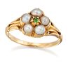 A GREEN GARNET AND SPLIT PEARL CLUSTER RING, a round-cut green garnet withi