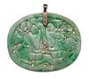 A JADE PENDANT, oval form and finely carved and pierced depicting figures, 