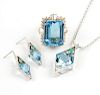 A group of blue topaz and diamond jewelry items