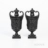 Pair of Wedgwood & Bentley Black Basalt Vases, England, c. 1780, each with scrolled handles and gadroon bands above Bacchanalian Boys in relief, impre
