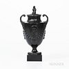 Wedgwood & Bentley Black Basalt Urn and Cover, England, c. 1780, Sybil finial and scrolled handles, raised classical medallion above laurel and berry 
