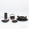 Five Wedgwood Black Basalt Items, England, 19th century, each with applied rosso antico relief, spill vase, ht. 3 5/8; basket, ht. 3 1/4; dish, dia. 3