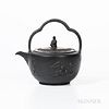 Wedgwood Black Basalt Teakettle and Cover, England, 19th century, trefoil bail handle to a circular shape with Sybil finial, the body with Bacchanalia