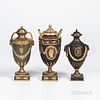 Three Wedgwood Gilded and Bronzed Black Basalt Vases with Covers, England, c. 1885, one with zodiac band above oval classical medallions bordered by f