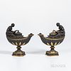 Two Wedgwood Gilded and Bronzed Black Basalt Oil Lamps and Covers, England, c. 1885, each oval, with fluted neck, oak leaf border and acanthus and bel