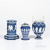 Three Wedgwood Dark Blue Jasper Dip Items, England, 19th and early 20th century, each with applied white relief, a torches vase and cover, ht. 7 1/8; 