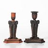 Two Similar Wedgwood Egyptian Candlesticks, England, early 19th century, a rosso antico with black basalt relief and a black basalt with rosso antico 