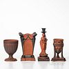 Four Wedgwood Rosso Antico Items, England, 19th century, each with applied black basalt relief, a tripod base incense burner, ht. 6 3/4; figural candl