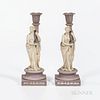 Two Wedgwood Lilac and White Jasper Candlesticks, England, 19th century, each with a maiden holding a cornucopia-shaped candle arm and standing on a r