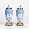 Pair of Brass Mounted Wedgwood Light Blue Jasper Vases and Covers, England, 19th century, applied white foliate borders and classical figures of child