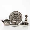 Six Wedgwood Black Jasper Dip Items, England, 19th century, each with applied white classical decoration, including two trophy plates, dia. 6 1/4, 8 5