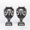 Pair of Wedgwood Black Jasper Dip Vases, England, mid-19th century, each with applied white classical medallions within floral festoons terminating at