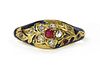 A gold enamel ruby and diamond ring,