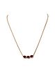 An 18ct rose gold three stone ruby pendant, by Fabergé,
