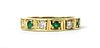 An 18ct emerald and diamond half eternity ring,