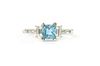 An 18ct white gold aquamarine and diamond three stone ring,