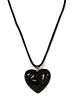 A black glass heart shaped pendant, by Baccarat,