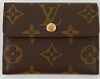 Louis Vuitton Card Organizer, the brown monogram coated canvas with golden brass snap, opening to three card compartments, with exterior pocket and sn