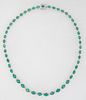Platinum Link Necklace, each of the forty-nine oval links with a graduated oval faceted emerald atop a border of tiny round diamonds, total emerald wt