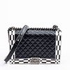Chanel Medium Checkerboard Boy Shoulder Bag, c. 2014, in black and white quilted lambskin with metal brass hardware, opening to a black silk canvas li
