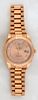 Man's Rolex Presidential 18K Rose Gold Oyster Perpetual Day-Date, with a fluted bezel, and a custom gold after market face, with diamond mounted Roman