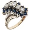 RING WITH SAPPHIRES AND DIAMONDS IN 12K WHITE GOLD Round cut sapphires ~0.84 ct, Brilliant cut diamonds ~0.50 ct. Size: 8 | ANILLO CON ZAFIROS Y DIAMA