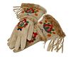 A pair of beaded hide and fur trimmed gauntlets