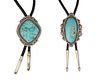 Two large silver and turquoise bolo ties