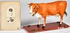 Hide covered cow on wheeled platform pull toy