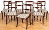 Set of seven Classical mahogany sabre leg chairs