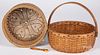 Two woven baskets, one with heart carved bottom