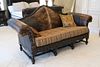 Large sofa with tooled leather hair-on-Hyde inserts and button tufted Chanel seat