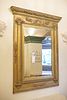 Antique gilt finished mirror in tabernacle frame