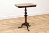 A rosewood tripod table in the manner of Gillows,